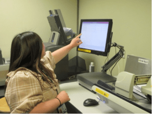 Picture of Individual pointing at a PC Screen