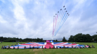 Picture of Red arrows flying over union jack flag